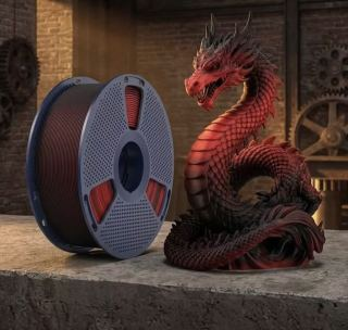 3D-geprinte drakenfiguur naast een spoel filament